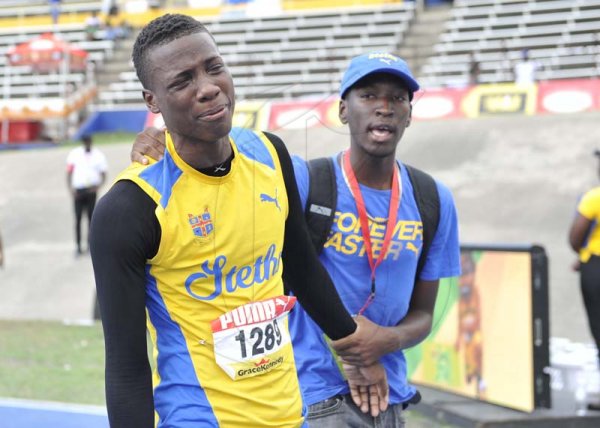 Shorn Hector/Photographer A distraught Michael Buchanan of St Elizabeth technical  after being ejected from the boys class one 110 meter hurdles on day four of the ISSA/GraceKennedy Boys and Girls’ Athletics Championships held at the The National Stadium in Kingston on Friday March 29, 2019