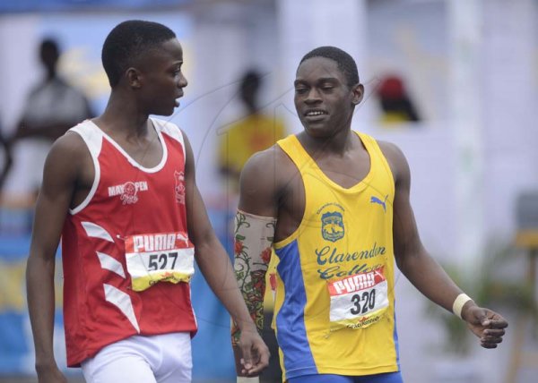 Shorn Hector/Photographer Richard Nelson of Clarendon College (right) chats withOshane Israel after winning heat four of the boys class two 100 meter dash on day three of the ISSA/GraceKennedy Boys and Girls’ Athletics Championships held at the The National Stadium in Kingston on Thursday March 28, 2019