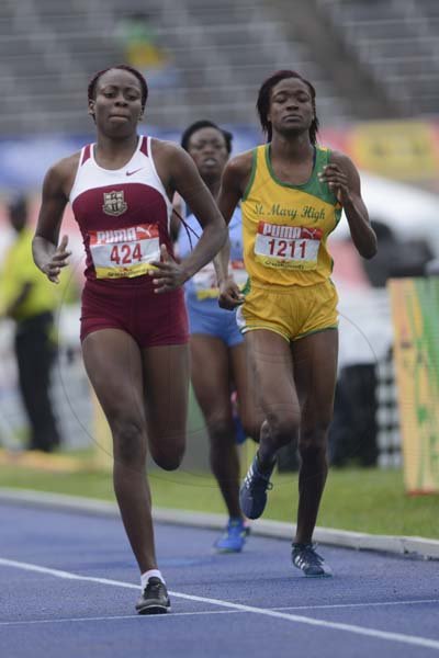 Shorn Hector/Photographer Sasha Brown of Homwood Technical (right) strides to victory in heat three of the girls class one 800 meters on day three of the ISSA/GraceKennedy Boys and Girls’ Athletics Championships held at the The National Stadium in Kingston on Thursday March 28, 2019