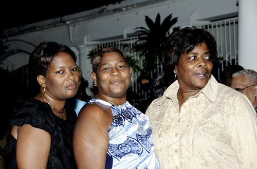 Winston Sill / Freelance Photographer
Birthday girl  Debbie Hamilton-Crooks (right) shares a pic with her sisters, Kerry Hamilton-Pearson (left) and Stacy Hamilton.



Debbi Hamilton-Crooks celebrates her birthday with Family and Friends at a party, held at Argyle Road, St. Andrew on Friday night September 9, 2011.