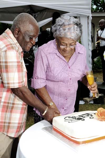 Winston Sill/Freelance Photographer
Debbie? Hamilton 50th Birthday Party, held at Ham Stables, Port Henderson Road, Portmore on Sunday September 8, 2013. Here Debbie parents cuts a cake in celebration of her father's birthday.