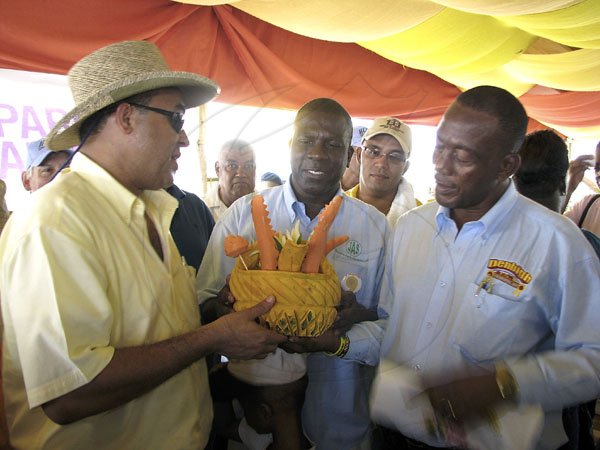 Dr Christopher Tufton (left), former Minister of Agriculture & Fisheries; Senator Norman Grant (second left), first vice president/chairman, Denbigh Committee; Glendon Harris (right), president, Jamaica Agricultural Society and (in background) Dr Marc Panton, chief technical director, Ministry of Agriculture & Fisheries and Lenworth Fulton, executive director, Jamaica 4H Clubs.