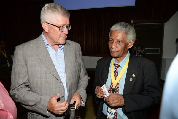 Jermaine Barnaby/ Freelance PhotographerDr. Max Blouw (left) president and vice-chancellor Wilfred Laurier University and Neville Ying, actg. Executive Director of the Mona School of Business, UWI having a discussion at the Jamaica Diaspora 55 at the Jamaica Conference Centre in Kingston on Tuesday July 25, 2017.