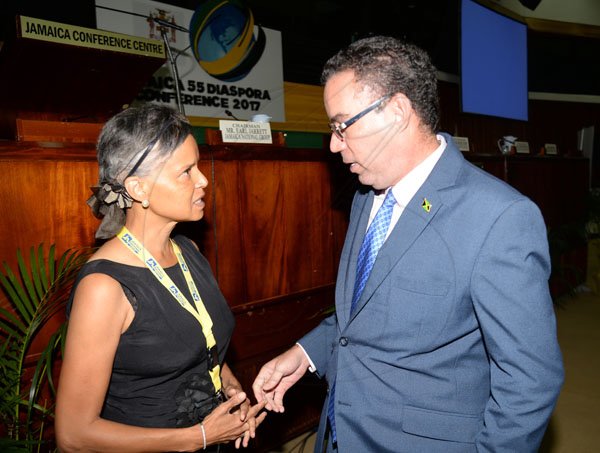 Jermaine Barnaby/ Freelance PhotographerHon. Daryl Vaz (right) Minister without Portfolio in the Ministry of Economic Growth and Job Creation with responsibility for the Land, Environment, Climate Change having a discussion with Victoria Rowell, producer/ Director, The Rich and The Ruthless soap opera during the Jamaica Diaspora 55 at the Jamaica Conference Centre in Kingston on Tuesday July 25, 2017.