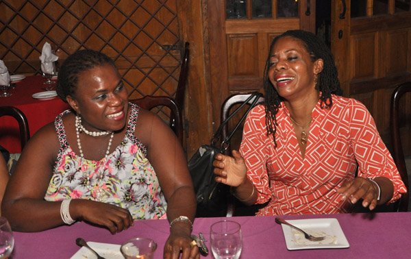 Jermaine Barnaby/Photographer
Carleen Mc Farlane (right) enjoying the company of Carol Archer during The Gleaner's Pre-Restaurant Week Dinner Promotions 2013 with Karin Cooper and guests at  Red Bones on Tuesday, November 5, 2013.