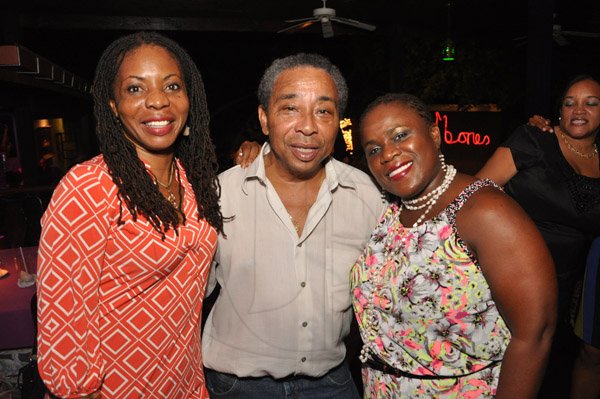 Jermaine Barnaby/Photographer
Evan Williams (cenetr) proprietor of Redbones share some lens time with Carleen Mc Farlane (left) and Carol Archer during The Gleaner's Pre-Restaurant Week Dinner Promotions 2013 with Karin Cooper and guests at  Red Bones on Tuesday, November 5, 2013.