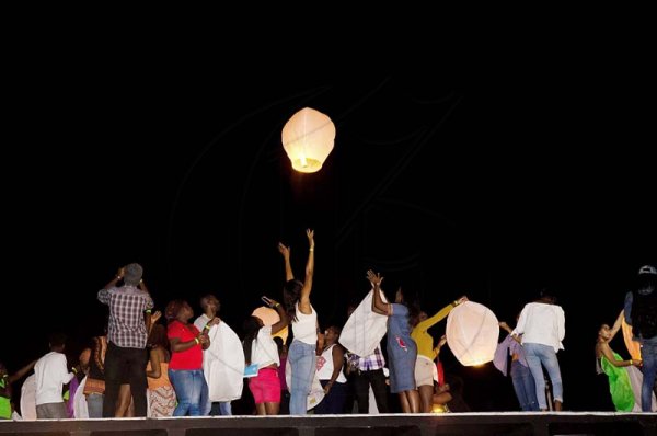 Shorn Hector/Photographer   Patrons releasing their lanterns at the Earth Hour concert held at Ranny William Entertainment Centre on March 25, 2018
