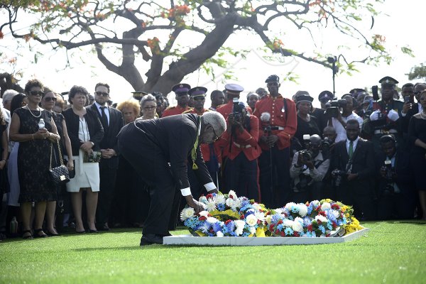 Shorn Hector/Photographer The Hon. Pearnel Charles  lays a wreath on the entombed area of the late Edward Seaga at the National Heroes Cricleon Sunday June 23, 2019.