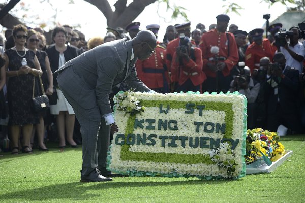 Shorn Hector/Photographer Desmond McKenzie, member of parliament for West Kingston,  lays a wreath on the entombed area of the late Edward Seaga at the National Heroes Cricleon Sunday June 23, 2019.
