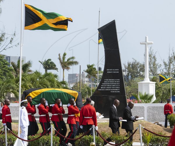 Gladstone Taylor / PhotographerMembers of the first batalion Jamaica Regiment 1JR bearer party passes the Michael Monument carrying the coffin at interment segment of the state funeral of former primeminister the most honourable Edward Seaga at the national heroes park in kingston on sunday june 23, 2019.