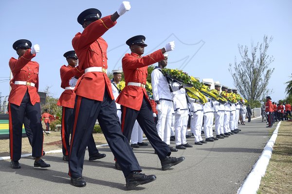 Shorn Hector/Photographer Soldiers marching during the burial ceremony of the late Edward Seaga, former Prime Minister of Jamaica, on Sunday June 23, 2019
