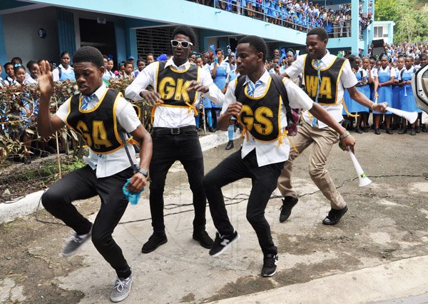 Jermaine Barnaby/Photographer
A dance group shows off a few dance moves during champs celebration win at Edwin Allen school on Monday March 30, 2015.