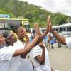 Jermaine Barnaby/Photographer
Dr. Everton Walters (right) principal of Edwin Allen gives high fives to the winning 4 x 100m relay team members from left; Lisandra Brown, Shanique Rowe, Kevona Davis and Selisa Palmer during the schools' Champs win celebration at the school on Monday March 30, 2015.