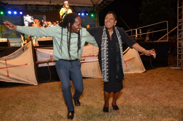 Shorn Hector/Photographer  From LeftMinister of State in the Ministry of Culture, Gender, Entertainment and Sport, Alando Terrelonge, Minister of Culture, Gender, Entertainment and Sport, Olivia Grange dancing together at the Seville Emancipation Jubilee 2018