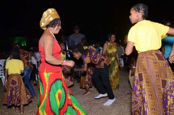 Shorn Hector/Photographer  
Left proffesspor Verene Shepherd dancing with members of the  Charles Town Marroons performing at the Seville Emancipation jubilee 2018.
