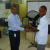 Contributed 
 Robin Williams  of the Gleaner makes a presentation Rawle Bent Pricipal Maggoty high