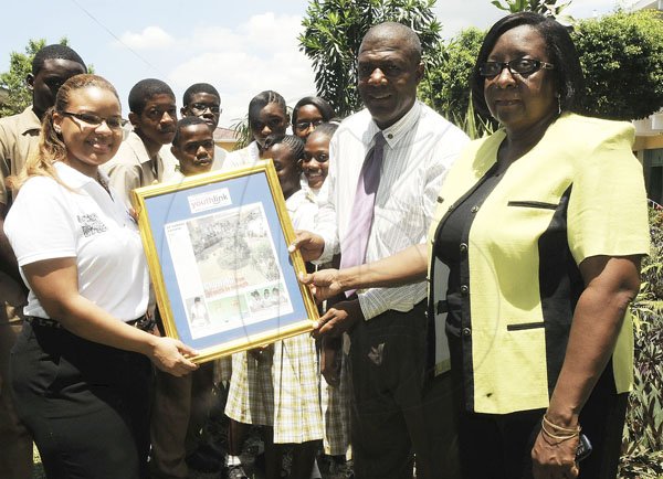 Gladstone Taylor / Photographer


Samantha Burke Presents a plaque on behalf of the gleaner company in celebration of teachers day to Judith Hutchinson (teacher rep) and Paul McCallum (vice principal, Edith Dalton James High School) as seen at Edith Dalton James High School