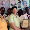 Contributed 
Maxine Evans (fourth from left), the principal of Green Island High School, in Hanover, accept a Gleaner 'Youth Link Plaque' from Denique Mattis (right), the head of circulation for the Gleaner Company in western Jamaica. Collette Myers (left), the school's Youth Link coordinator, and a group of students shares the occasion.