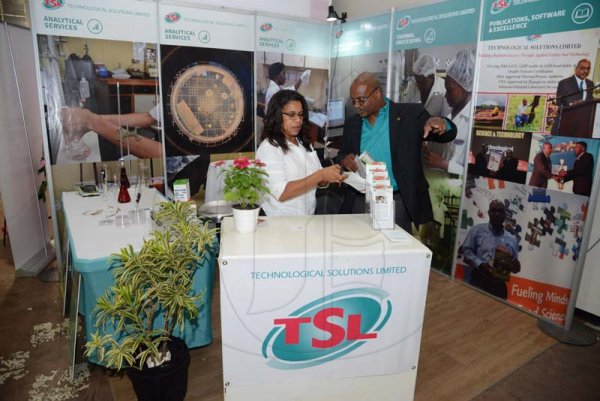 Rudolph Brown/ PhotographerCamille Beckford Brown, Customer Care, Business Development and Marketing Manager of Technological Solutions Limited and Dr. Andre Gordon,  Managing Director of Technological Solutions Limited at the JEA JMA Expo Jamaica at the National Indoor Sports Centre and the National Arena on Sunday April 22, 2018