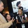 Rudolph Brown/ PhotographerKareen Lamme, (right) licensed Beauuty Therapist of Bute Cosmetics show  Prime Minister Andrew Holness her product while Michelle Chong, (centre) President, Jamaica Exporters' Association (JEA) during a tour of the JEA JMA Expo Jamaica at the National Indoor Sports Centre and the National Arena on Sunday April 22, 2018