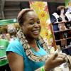 Rudolph Brown/ Photographer<\n>Janice Forrester (left), manager of Jan's Accents, plays with a snake which was part of the Hope Zoo exhibit at Expo Jamaica 2018.<\n><\n><\n>