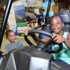 Rudolph Brown/ PhotographerBrayden Nugent and Brianna Nugent try out the Jam West car at the JEA JMA Expo Jamaica at the National Indoor Sports Centre and the National Arena on Sunday April 22, 2018
