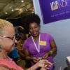 Rudolph Brown/ PhotographerKemoy Morgan, (right) Designer and Goldsmith show her product to a buyer at the JEA JMA Expo Jamaica at the National Indoor Sports Centre and the National Arena on Sunday April 22, 2018