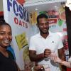 Rudolph Brown/ PhotographerKathryn Silvera, (right) Adv and Marketing Manager of Ramsons give a sample to Dominic Alken and Kerry-Ann Alken at the JEA JMA Expo Jamaica at the National Indoor Sports Centre and the National Arena on Sunday April 22, 2018