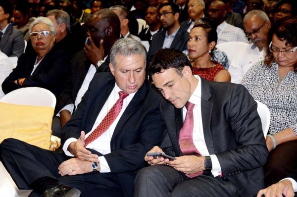 Shorn Hector/Photographer   Metry Seaga President of the Jamaica Manufacturers' Association (left) talks with Justin Morin Chief Executive Officer Digicel Jamaica  at the Expo Jamaica 2018 Opening Ceremony at the National Indoor Sports Complex on April 19 2018
