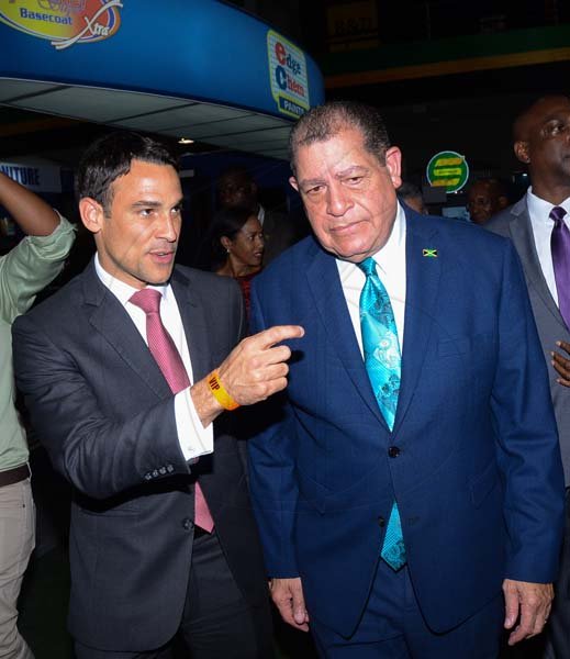 Shorn Hector/Photographer   Justin Morin Chief Executive Officer Digicel Jamaica (left) in conversation with The Hon. Audley Shaw Minister of Industry, Commerce, Agriculture and Fisheries at the Expo Jamaica 2018 Opening Ceremony at the National Indoor Sports Complex on April 19 2018