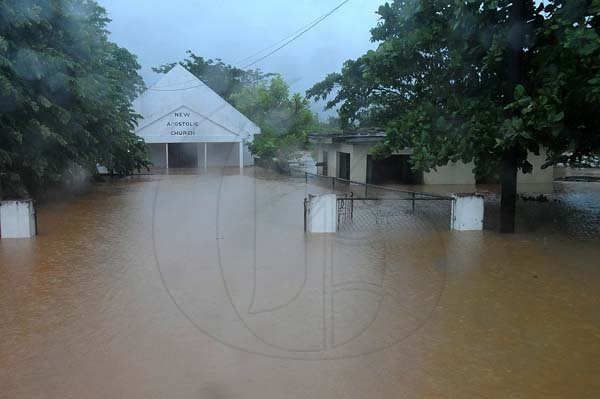 Ian Allen/Photographer
The New Apostolic Church in Osbourne Store in Clarendon under flood waters during heavy rains on wednesday.