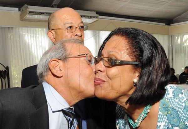 Rudolph Brown/ Photographer
Robert Levy, Chairman of Jamaica Broilers Group kissed Carmen Patterson while brother Don Patterson looks on at the Fair Play award of excellence 2013/2014 held at the Terra Nova Hotel, Kingston on September 16, 2014