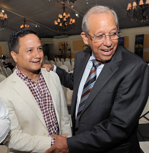 Rudolph Brown/ Photographer
Robert Levy, (right) Chairman of Jamaica Broilers Group chat with Omar Azan at the Fair Play award of excellence 2013/2014 held at the Terra Nova Hotel, Kingston on September 16, 2014