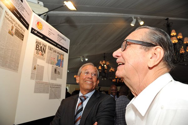 Rudolph Brown/ Photographer
Robert Levy, (left) Chairman of Jamaica Broilers Group and R. Danny williams looks at the display at the Fair Play award of excellence 2013/2014 held at the Terra Nova Hotel, Kingston on September 16, 2014