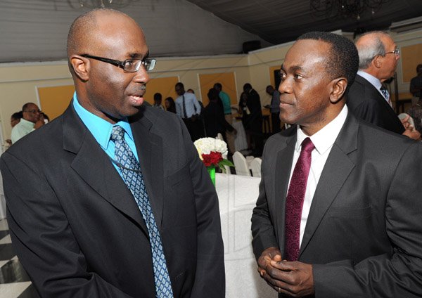 Rudolph Brown/ Photographer
Gary Allen, (left) Managing Director of the RJR Communications Group chat with Professor Hopeton Dunn at the Fair Play award of excellence 2013/2014 held at the Terra Nova Hotel, Kingston on September 16, 2014