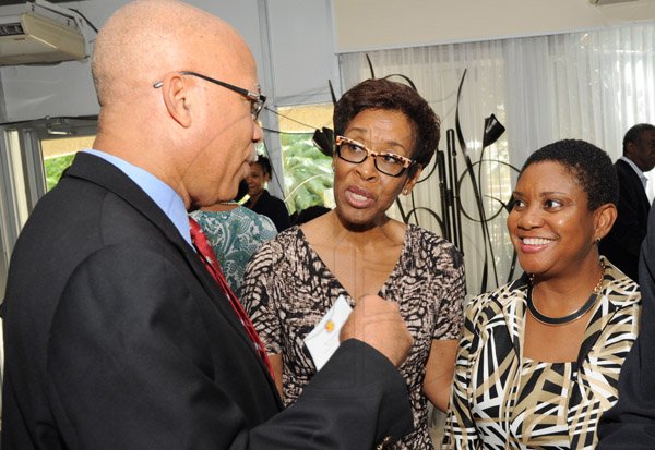 Rudolph Brown/ Photographer
Oral McCook chat with Dr. Claudette Cooke, (centre) and Joan Forrest Henry,  Divisional Sales and Marketing Manager of Best Dres Chicken  at the Fair Play award of excellence 2013/2014 held at the Terra Nova Hotel, Kingston on September 16, 2014
