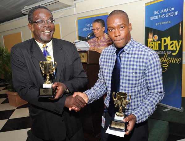 Rudolph Brown/ Photographer
Arthur Hall, (left) and Ryon Jones winners of the Fair Play award at the Fair Play award of excellence 2013/2014 held at the Terra Nova Hotel, Kingston on September 16, 2014