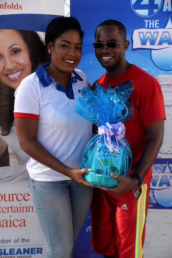 Lionel Rookwood/PhotographerThe Gleaner's Fit 4 Life Sweatfest at the Life Fit Training Centre, 15 3/4 Red Hills Road, St Andrew, with aerobics instructor O.J. O'Gilvie on Saturday, November 18, 2017. *** Local Caption *** Lionel Rookwood/PhotographerAhon Gray (right) wins a gift basket from Chas E. Ramson brand manager, Sherida Cohen.