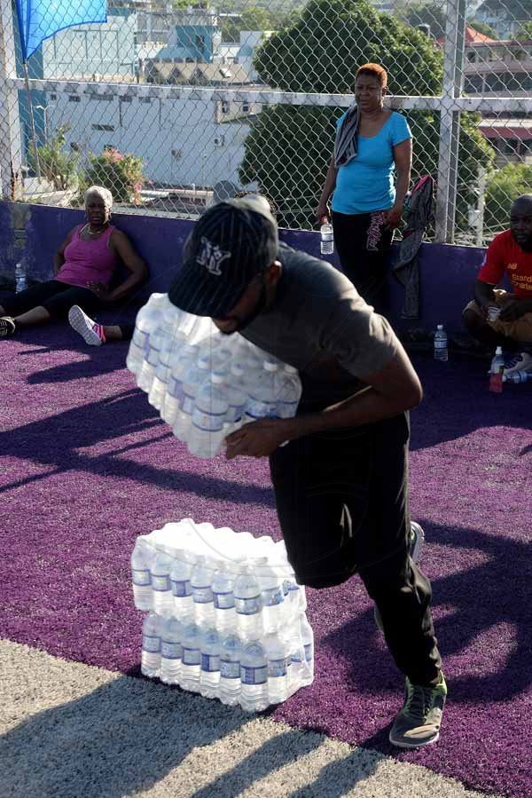 Lionel Rookwood/PhotographerThe Gleaner's Fit 4 Life Sweatfest at the Life Fit Training Centre, 15 3/4 Red Hills Road, St Andrew, with aerobics instructor O.J. O'Gilvie on Saturday, November 18, 2017. *** Local Caption *** Lionel Rookwood/PhotographerTeino Evans racing against the clock in the WATA challenge, sponsor of The Gleaner's Fit 4 Life.