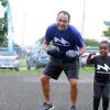 The Gleaner's Fit 4 Life event with the Trainfit Club's Outdoor Madness, Boxing Fitness with Sakima Mullings and Self Defense with Master Arthur Barrows on Saturday, November 11, at In Motion Gym, Shortwood Teachers' College, St Andrew. *** Local Caption *** Minister of Health Dr Christopher Tufton dukes it out with this youngster at The Gleaner's Fit 4 Life event with the Trainfit Club's Outdoor Madness, Boxing Fitness with Sakima Mullings and Self Defense with Master Arthur Barrows on Saturday at In Motion Gym, Shortwood Teachers' College, St Andrew.
