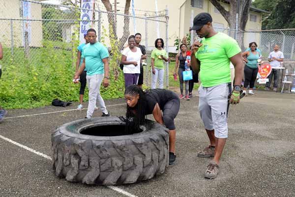Lionel Rookwood/PhotographerThe Gleaner's Fit 4 Life event with the Trainfit Club's Outdoor Madness, Boxing Fitness with Sakima Mullings and Self Defense with Master Arthur Barrows on Saturday, November 11, at In Motion Gym, Shortwood Teachers' College, St Andrew. *** Local Caption *** Lionel Rookwood/PhotographerTaking the obstacle boot camp challenge.