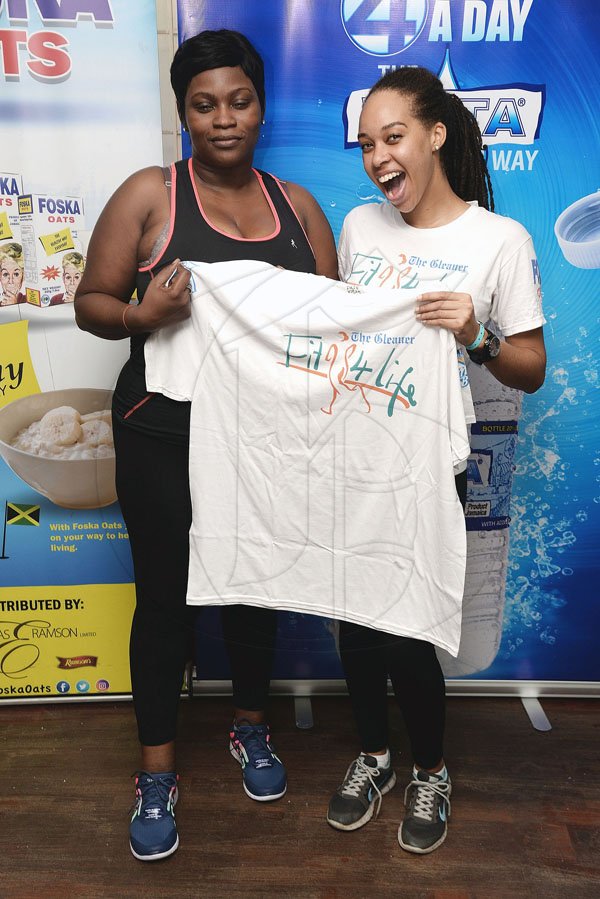 Lionel Rookwood/PhotographerThe Gleaner's Fit 4 Life event with Body By Kurt - FitMix - 3-The-Hard-Way - at 23 Haining Road, New Kingston on Saturday, October 28, 2017.  *** Local Caption *** Lionel Rookwood/PhotographerWata Challenge third place winner, Trecia McGowan, taking home her prize from The Gleaner's Fit 4 Life marketing officer Amashika Lorne.