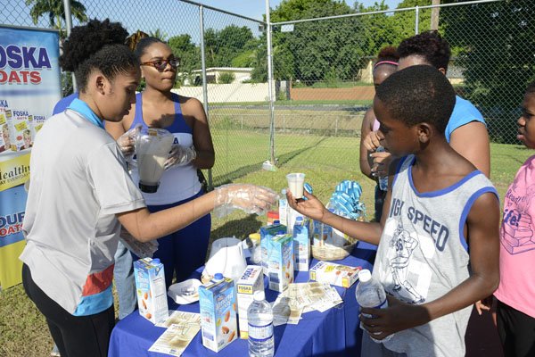 Ian Allen/PhotographerThe Gleaner's Fit 4 Life team at Hope Pastures Park, Hope Pastures, St Andrew on Saturday, October 14, 2017. *** Local Caption *** Ian Allen/PhotographerEnjoying delights from Fit 4 Life sponsor Chas E Ramson, made with products Foska Oats and Blue Diamond Almond Milk.