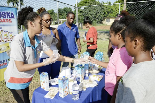 Ian Allen/PhotographerThe Gleaner's Fit 4 Life team at Hope Pastures Park, Hope Pastures, St Andrew on Saturday, October 14, 2017. *** Local Caption *** Ian Allen/PhotographerEnjoying delights from Fit 4 Life sponsor Chas E Ramson, made with products Foska Oats and Blue Diamond Almond Milk.