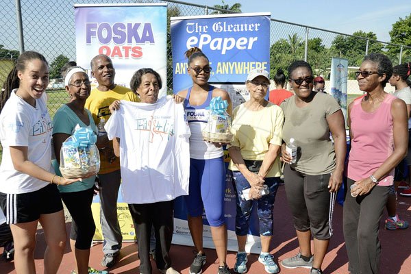 Ian Allen/PhotographerThe Gleaner's Fit 4 Life team at Hope Pastures Park, Hope Pastures, St Andrew on Saturday, October 14, 2017. *** Local Caption *** Ian Allen/PhotographerResidents of the Hope Pastures community accepting their prizes from The Gleaner's Fit 4 Life team and sponsor Chas E Ramson.