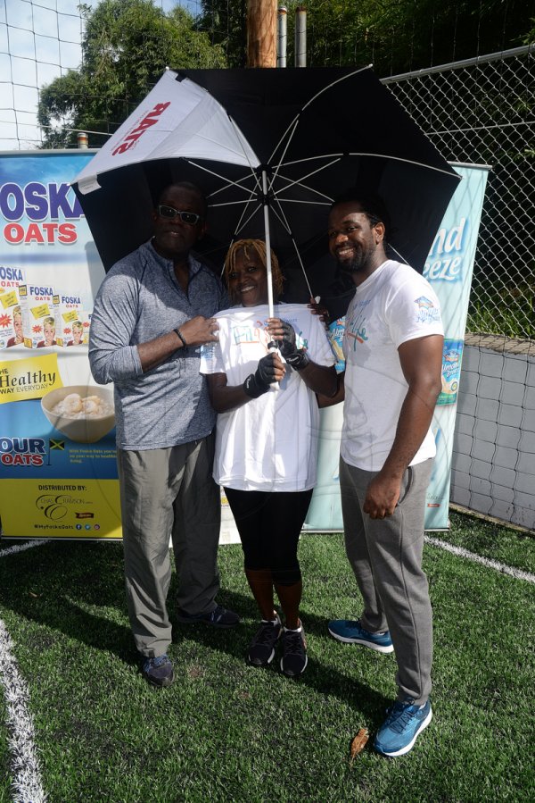 Lionel Rookwood/Photographer

Carol Douglas, winner of the weights challenge for women, with The Gleaner's Rainford Wint (left) and Marvin Gordon at The Gleaner's Fit 4 Life and St Matthew's Walkers event on Saturday, October 7, 2017 at the Jacks Hill Community Centre in St Andrew.
