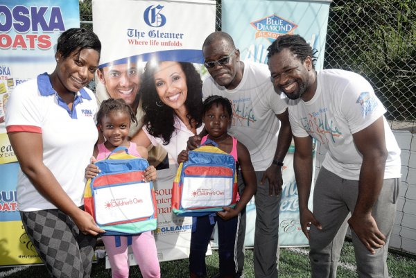 Lionel Rookwood/Photographer

The youngsters were out representing. Tyla Campbell (second left) and Kristine Edwards receive their prizes from Sherida Cohen, brand manager of Foska and Blue Diamond; Rainford Wint (second right) and Marvin Gordon of The Gleaner at The Gleaner's Fit 4 Life and St Matthew's Walkers event on Saturday, October 7, 2017 at the Jacks Hill Community Centre in St Andrew.