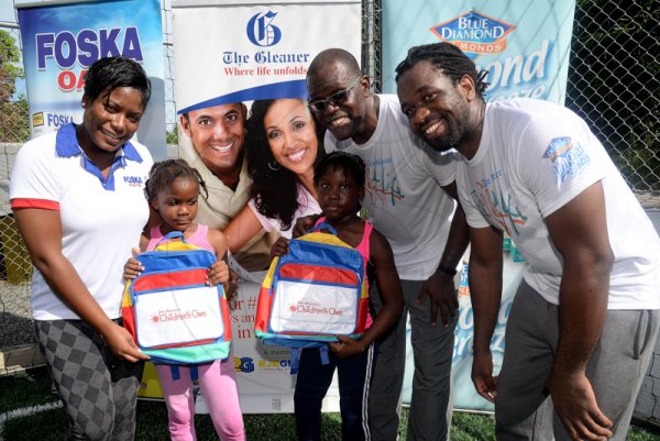 Lionel Rookwood/Photographer

The youngsters were out representing. Tyla Campbell (second left) and Kristine Edwards receive their prizes from Sherida Cohen, brand manager of Foska and Blue Diamond; Rainford Wint (second right) and Marvin Gordon of The Gleaner at The Gleaner's Fit 4 Life and St Matthew's Walkers event on Saturday, October 7, 2017 at the Jacks Hill Community Centre in St Andrew.