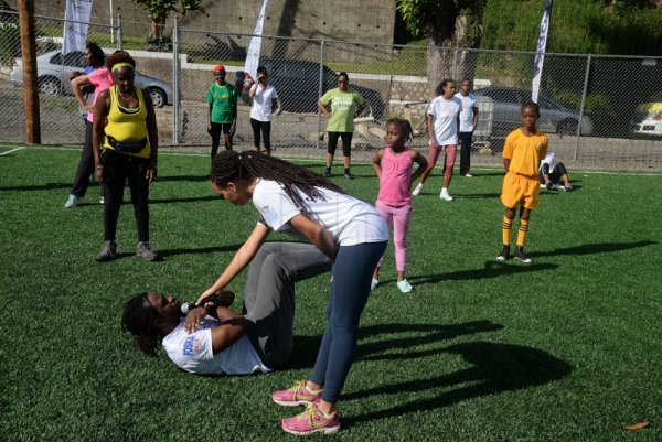 Lionel Rookwood/Photographer

Marvin Gordon demonstrates one of the exercises at The Gleaner's Fit 4 Life and St Matthew's Walkers event on Saturday, October 7, 2017 at the Jacks Hill Community Centre in St Andrew.