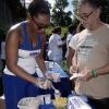 Lionel Rookwood/Photographer

President of the Jacks Hill Citizens Association gets a sample of the goodies on offer from a Chas E. Ramson representative at The Gleaner's Fit 4 Life and St Matthew's Walkers event on Saturday, October 7, 2017 at the Jacks Hill Community Centre in St Andrew.